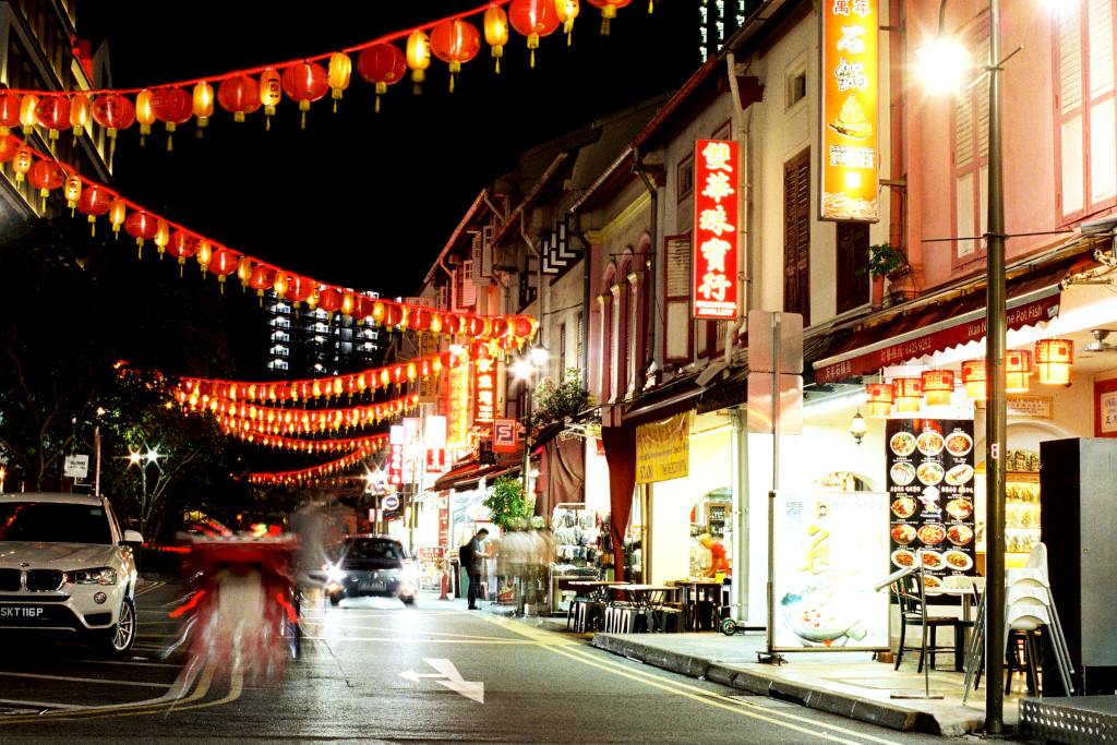 Shops and road in Chinatown at night