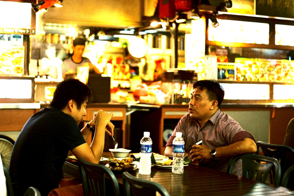 Men eating in Chinatown, Singapore